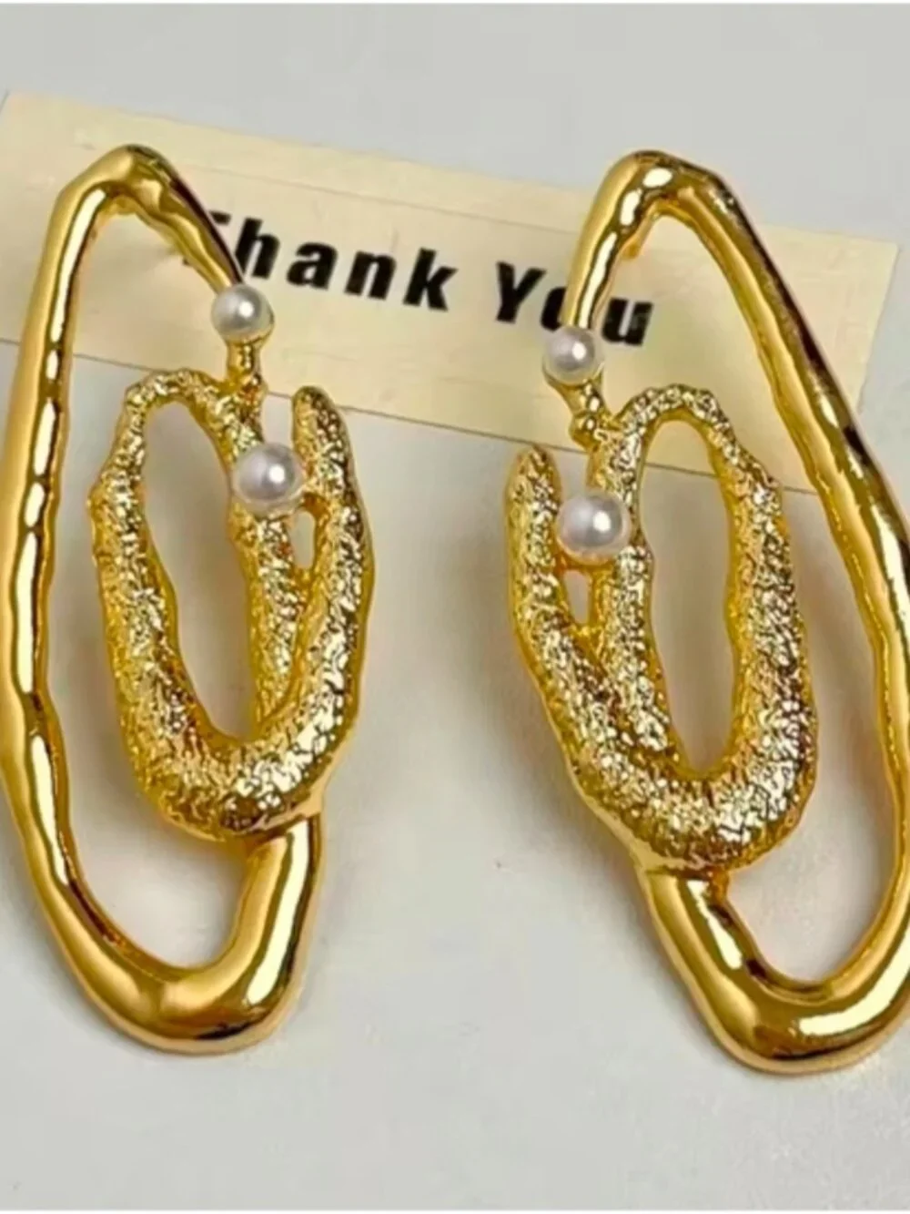 Gold tone Textured Loop Earrings with Pearl Accents